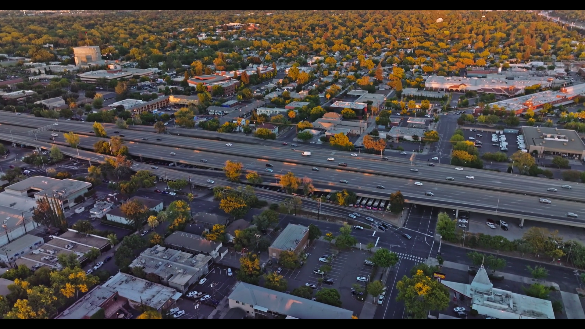 Aerial view of highway and city